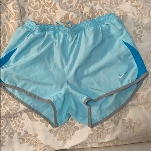 Blue Nike running shorts